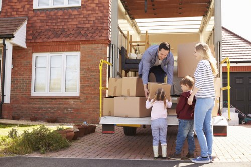 Man and van service with boxes being loaded for a UK move