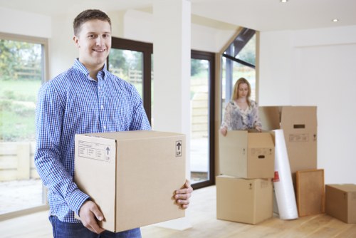 Office removals team handling desks and boxes in Balham