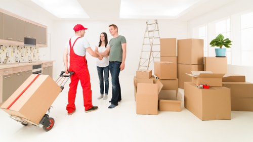 Professional moving van loading in a Balham street